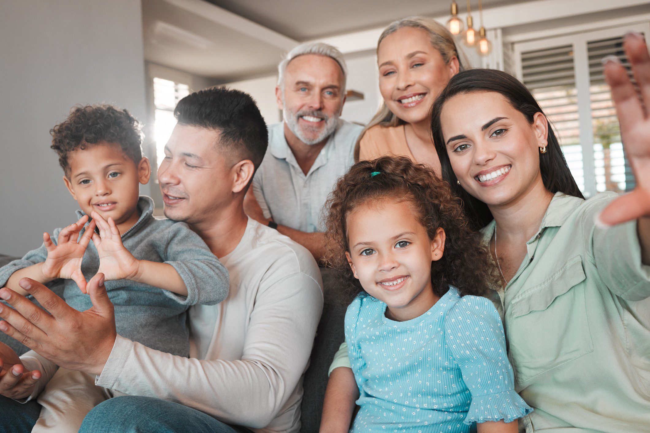 Smiling family posing for a group photo.