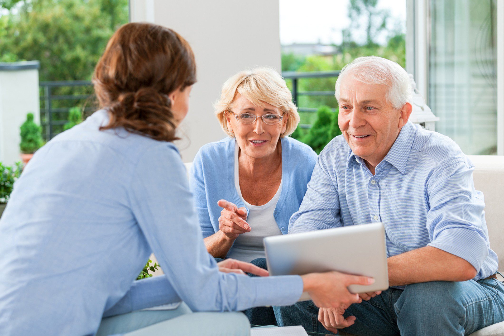 Senior couple consulting with a financial advisor.