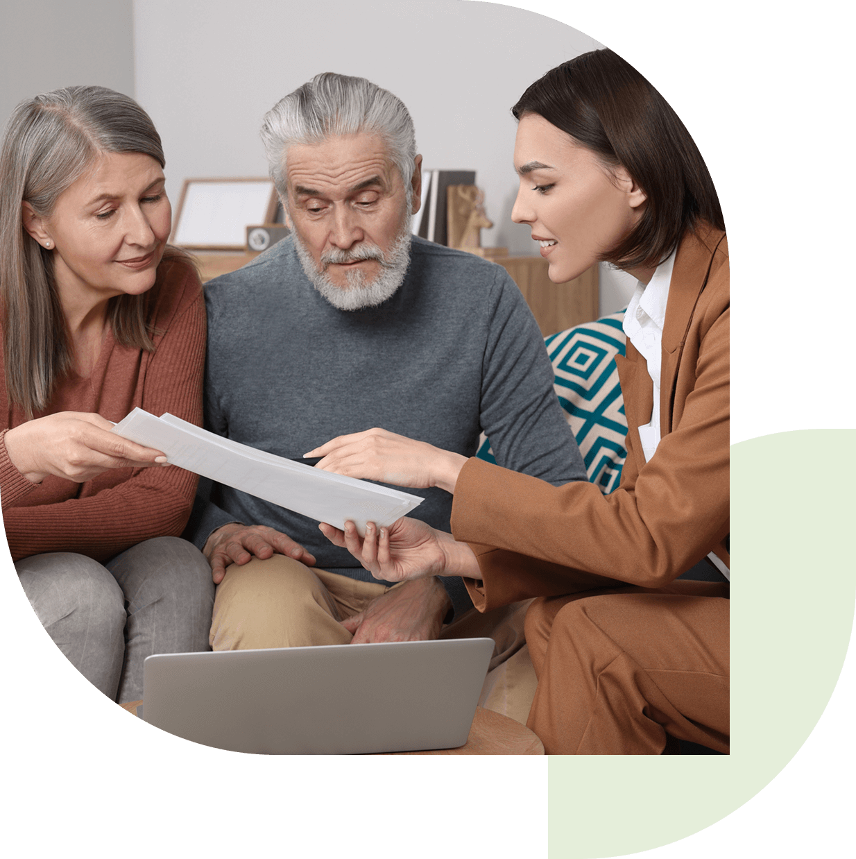 People reviewing documents together at home.